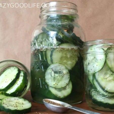 three jars of sweet pickles - one large in the middle and two small
