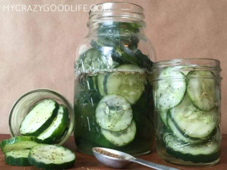 three jars of sweet pickles - one large in the middle and two small