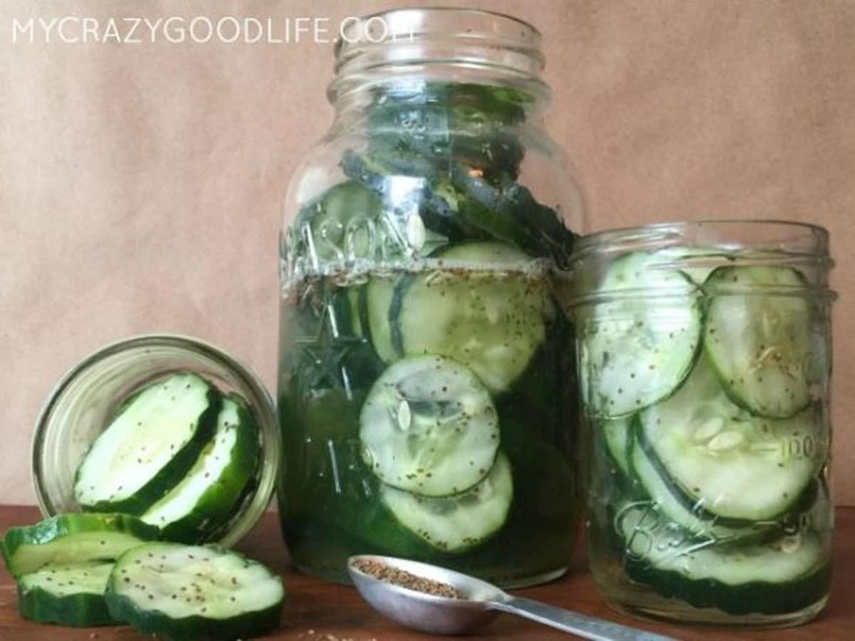 three jars of sweet pickles - one large in the middle and two small