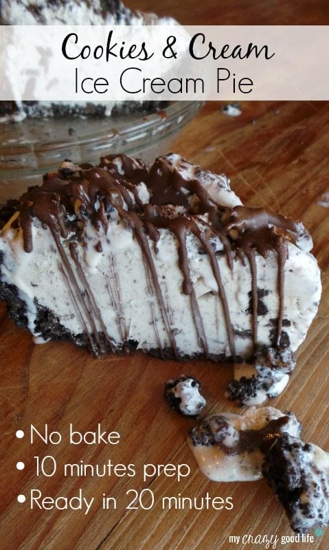 Image of Cookies and Cream Ice Cream Pie sitting on a wooden table. The Ice cream is garnished with crumbled cookies and chocolate drizzle.