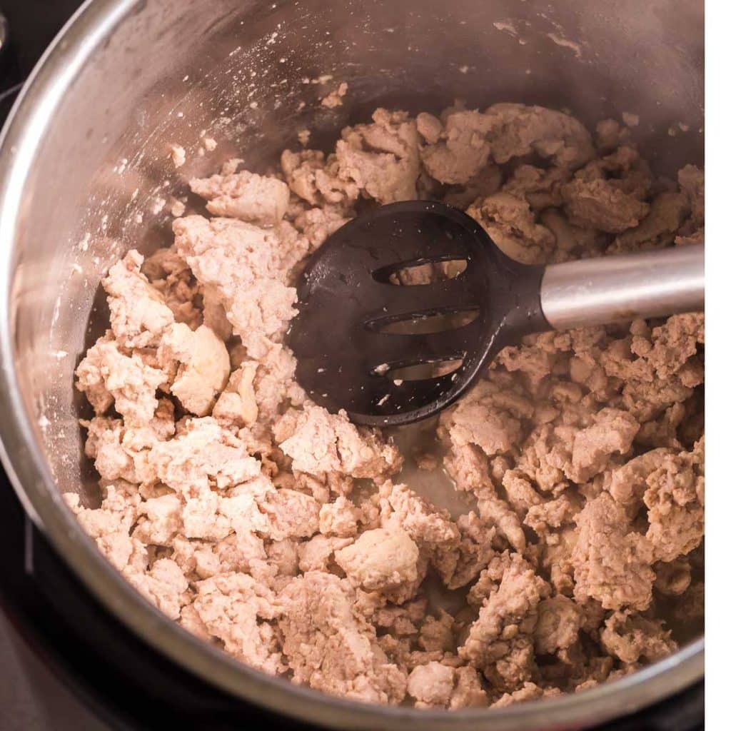 ground turkey being cooked in an instant pot