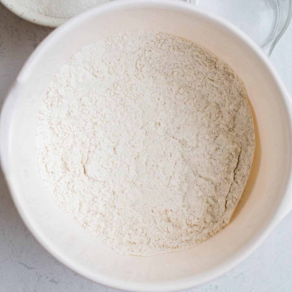 top down view of white bowl with dry ingredients mixed together