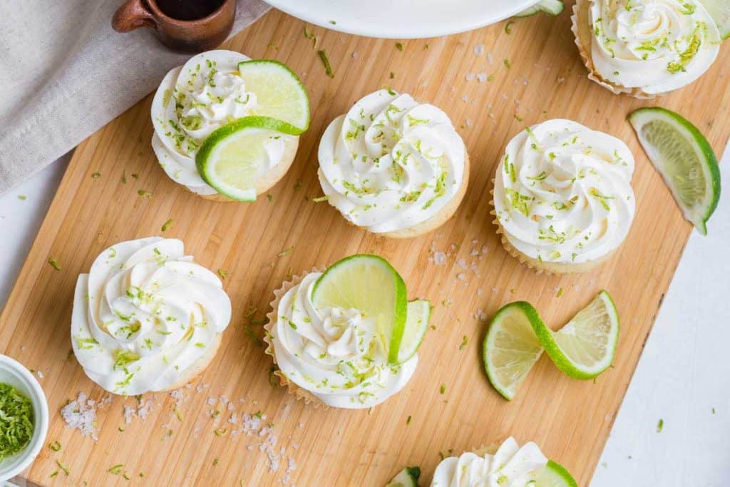 Margarita Cupcakes with frosting and garnished with a slice of lime