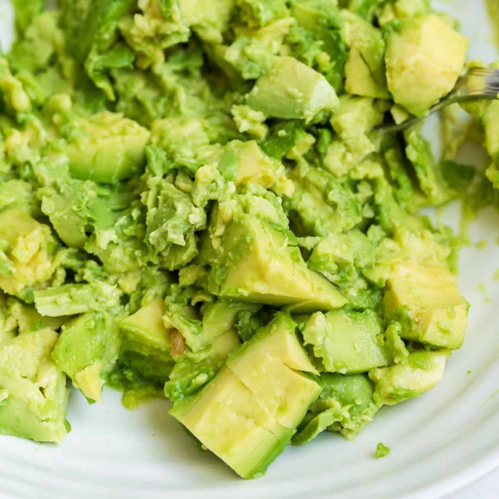 close up of chopped avocados for guacamole