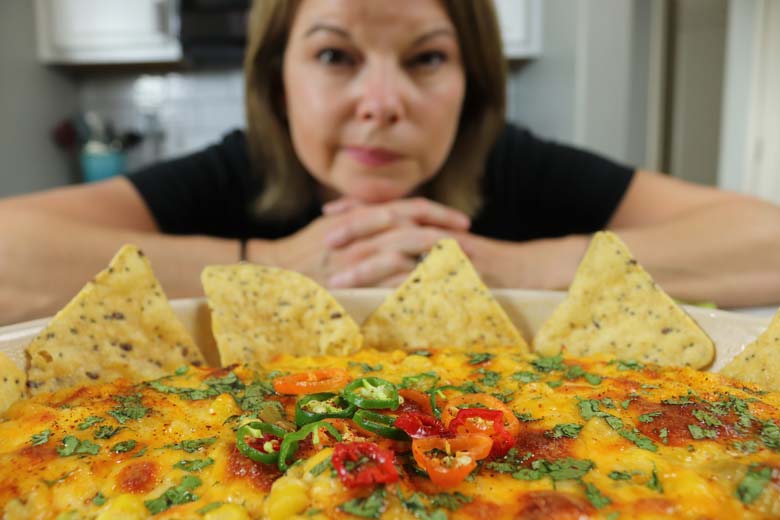 image of Becca with corn dip in front