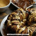 This monkey bread is amazing. It looks amazing, tastes amazing, and your kids will think you're the coolest mom ever for making it the morning after a sleepover. Ready to cheat a little on that diet? Peanut Butter Chocolate Monkey Bread.