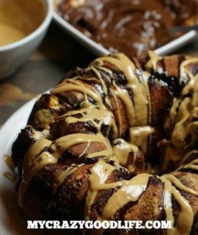 This monkey bread is amazing. It looks amazing, tastes amazing, and your kids will think you're the coolest mom ever for making it the morning after a sleepover. Ready to cheat a little on that diet? Peanut Butter Chocolate Monkey Bread.