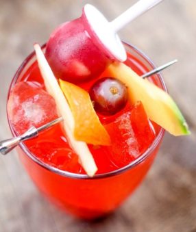This delicious and refreshing Strawberry Margarita Punch includes a fun and sweet fruit popsicle. It's perfect for cooling off and takes you back to the days when it was fun to dip your popsicle in your juice–you used to do that too, right?