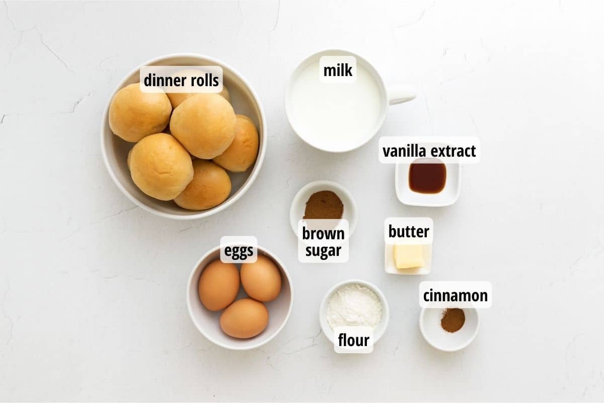 A white counter top with bowls of ingredients to make Easy Dinner Roll French Toast Casserole.
