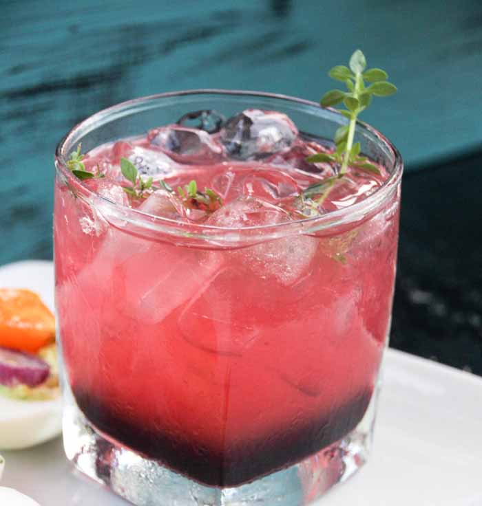 Delicious and hearty, this Berry Peach Bourbon Cocktail will impress your guests!