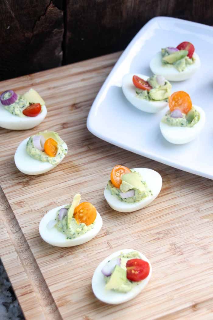 Everyone loves a good party food, Herbed Deviled Eggs are a great twist on a classic party finger food! They're delicious, savory, and beautiful displayed.