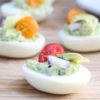 Everyone loves a good party food, Herbed Deviled Eggs are a great twist on a classic party finger food! They're delicious, savory, and beautiful displayed.