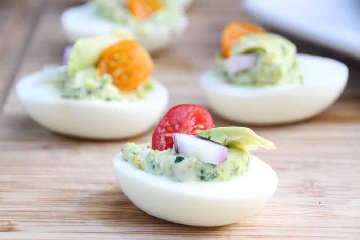 Everyone loves a good party food, Herbed Deviled Eggs are a great twist on a classic party finger food! They're delicious, savory, and beautiful displayed.