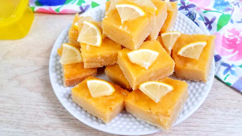 lemon bars on a white plate