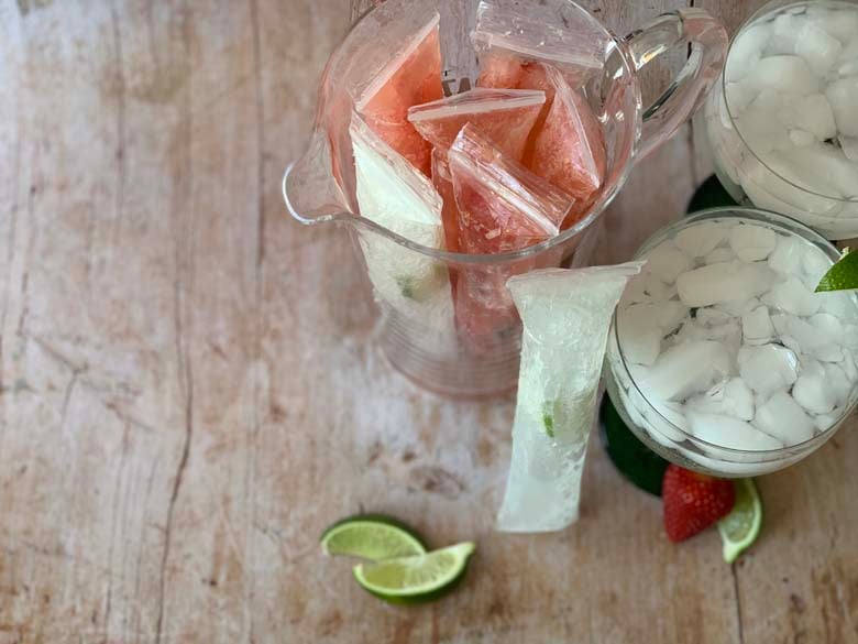 top down image of strawberry margarita popsicles in a pitcher