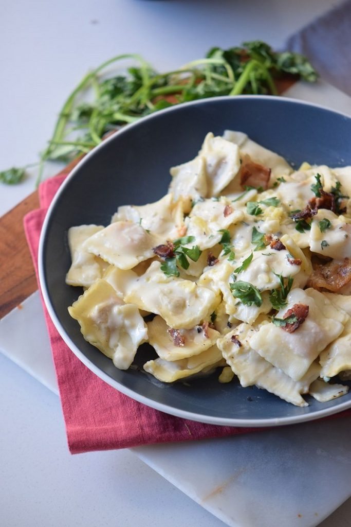 This Creamy Asiago Ravioli has all you expect from a good Italian recipe, it's easy to do, a total crowd pleaser, and out of this world good.