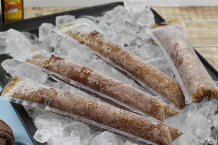 A tray of ice that is topped with dirty pirate popsicles.