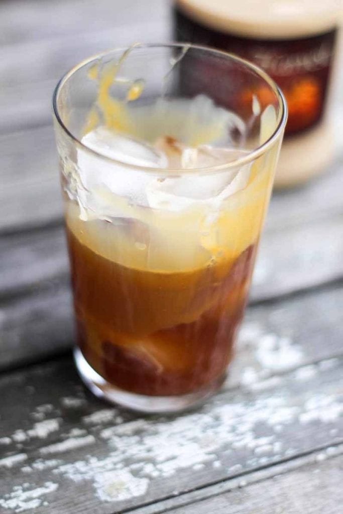 This Bourbon & Pumpkin Pie Iced Coffee is the perfect drink for fall! Served it iced or warm for those chilly fall evenings. It's the perfect amount of pumpkin! 