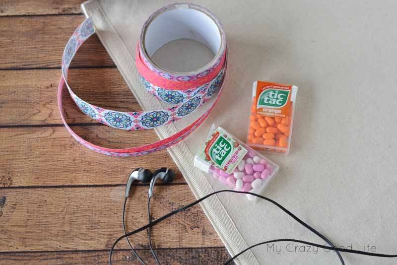 This quick and easy DIY Earbud Holder is a perfect way to store your earbuds. As a bonus, it's super easy to see at the bottom of your backpack or purse!