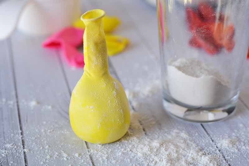 homemade stress ball with balloons–yellow balloon filled with flour