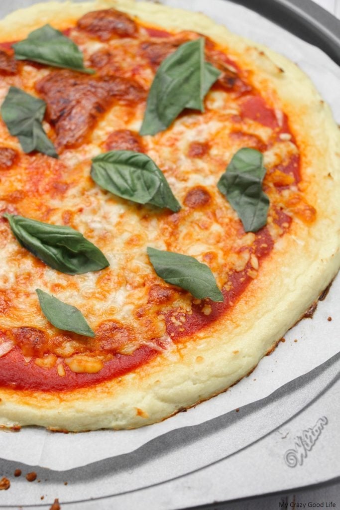 This low carb cauliflower pizza crust is a family favorite! It uses only 3 ingredients and is so easy to make on pizza night! 