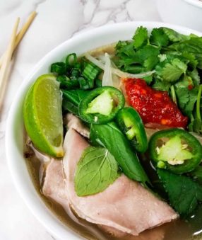instant pot beef pho in white bowl