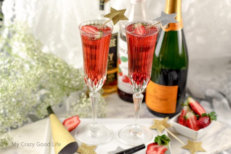 This Strawberry Whiskey Champagne Cocktail will impress your friends! Champagne cocktails are perfect happy hour drinks, as well as celebratory drinks! 