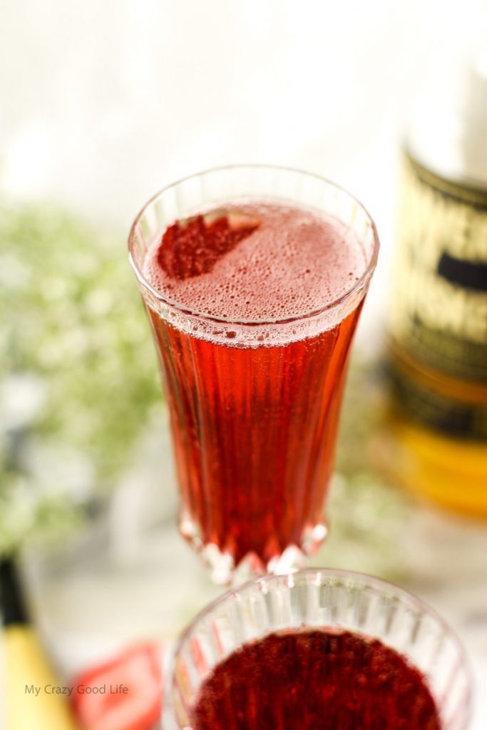 This Strawberry Whiskey Champagne Cocktail will impress your friends! Champagne cocktails are perfect happy hour drinks, as well as celebratory drinks! 