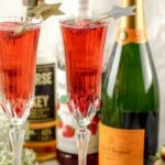 This Strawberry Whiskey Champagne Cocktail will impress your friends! Champagne cocktails are perfect happy hour drinks, as well as celebratory drinks!