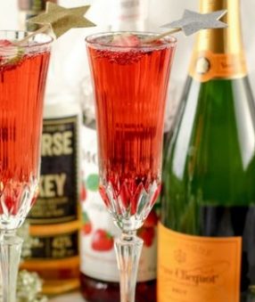 This Strawberry Whiskey Champagne Cocktail will impress your friends! Champagne cocktails are perfect happy hour drinks, as well as celebratory drinks!