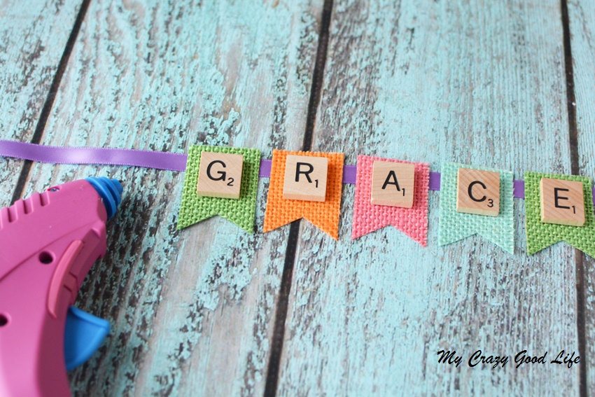 These adorable and customized Easter Baskets are the perfect Scrabble Tile Craft! They're an easy DIY Easter Basket that can be personalized several ways.