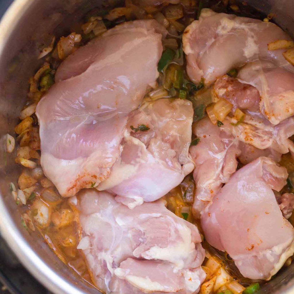 top down view of raw chicken thighs in the Instant Pot