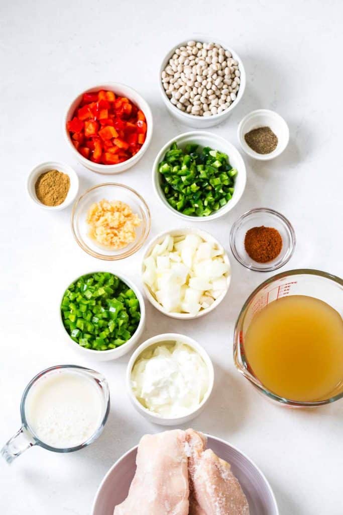 small bowls filled with ingredients needed to make White Chicken Chili