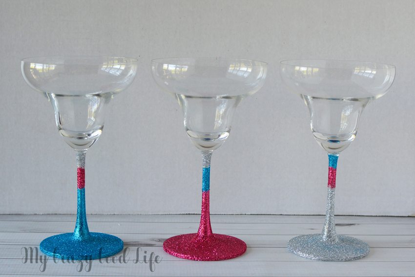 Making DIY glitter margarita glasses is an easy, fun, and useful project. You can keep them for yourself or add them to a gift basket! 