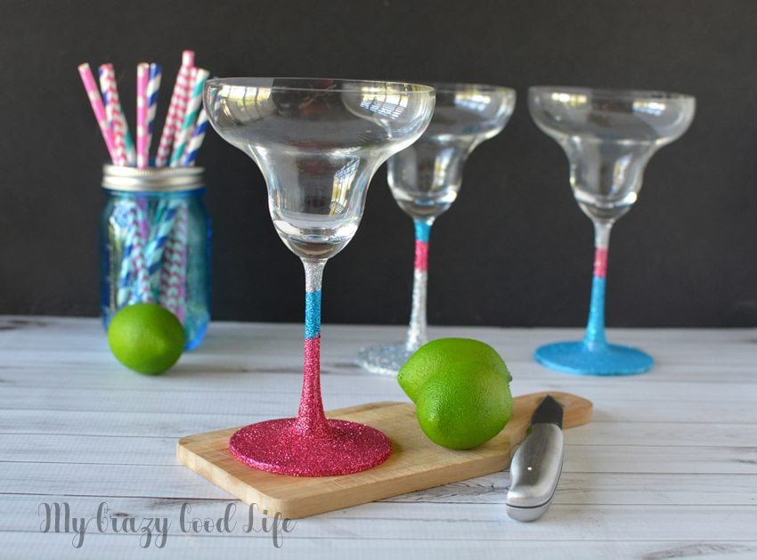 Making DIY glitter margarita glasses is an easy, fun, and useful project. You can keep them for yourself or add them to a gift basket! 