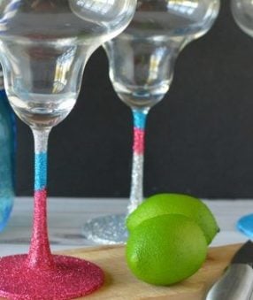 Making DIY glitter margarita glasses is an easy, fun, and useful project. You can keep them for yourself or add them to a gift basket!