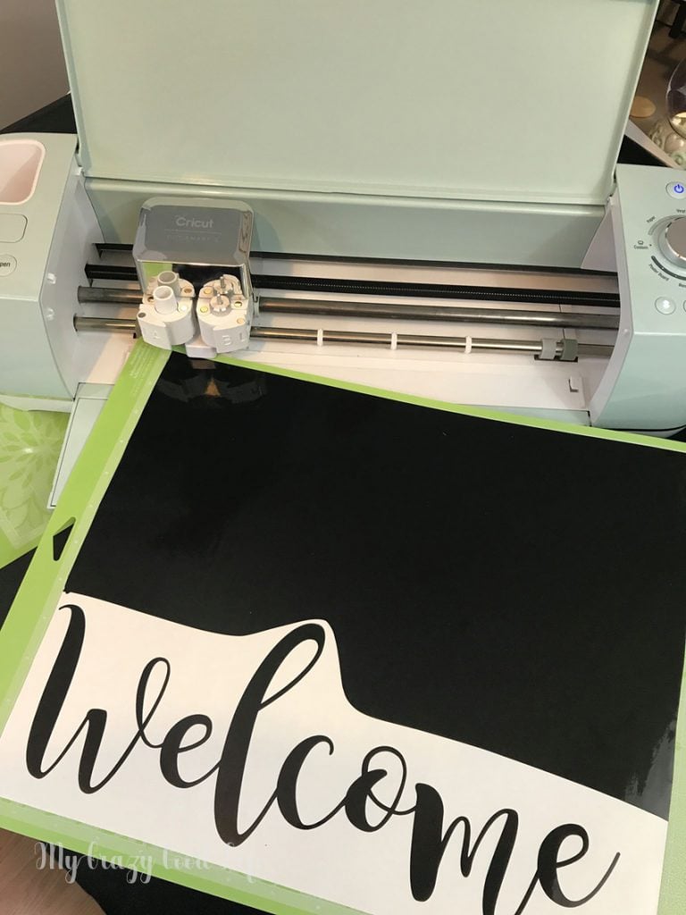 This Cricut welcome sign is a great weekend project. It's not too complicated and a DIY plant hanger makes a lovely addition to the front yard, porch, or give it as a gift!