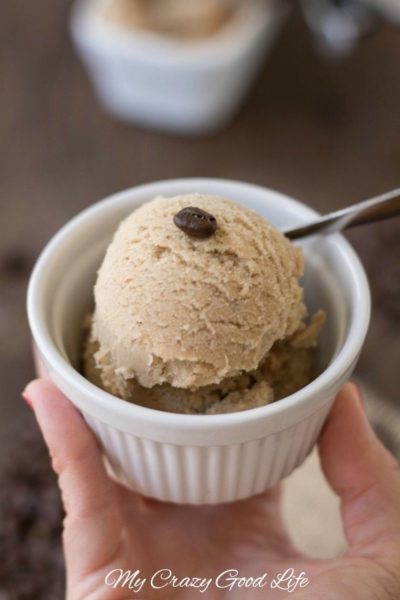 A white ramekin filled with Weight Watchers Dairy Free Coffee Ice Cream with a coffee bean on top and a silver spoon.