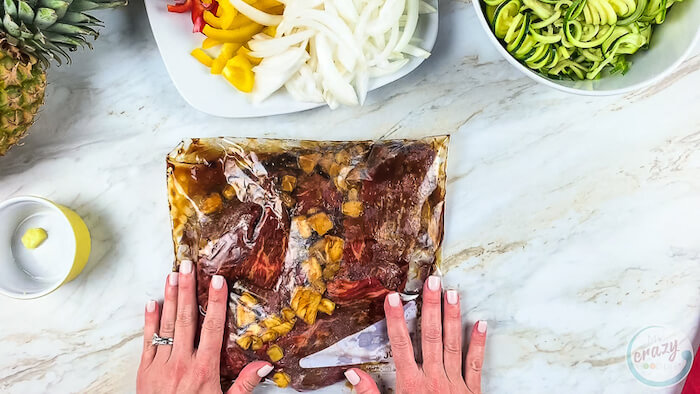 Showing a bag and how we marinade our steak and veggies