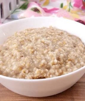 plain cooked steel cut oats in a white bowl