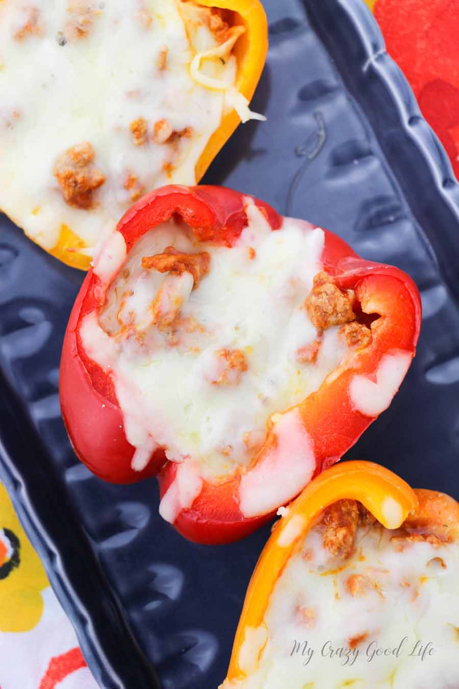 Slow cooker pizza stuffed peppers are a tasty twist on this classic dish. You can make this delicious recipe for lunch, dinner, or as a quick and easy meal prep for the week ahead! #slowcooker #21dayfix #recipes