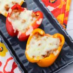 Slow cooker pizza stuffed peppers are a tasty twist on this classic dish. You can make this delicious recipe for lunch, dinner, or as a quick and easy meal prep for the week ahead! #slowcooker #21dayfix #recipes