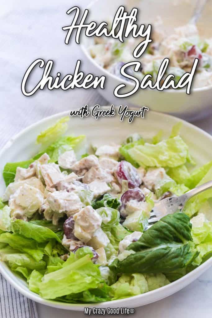 chicken salad on a bed of lettuce and a white plate