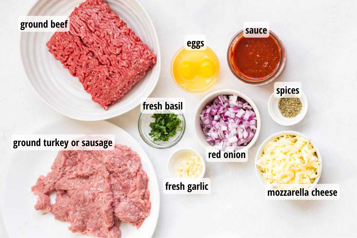 Ingredients in white and clear bowls for this crustless pizza recipe, on a white countertop.