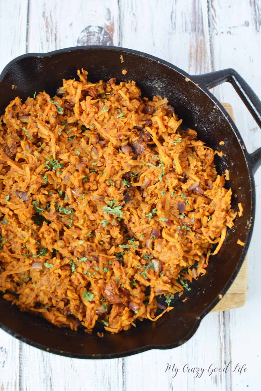 sweet potato hash browns in a cast iron skillet