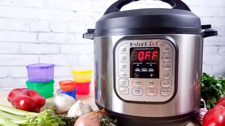 instant pot with vegetables and colored containers