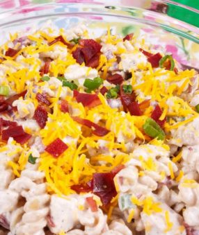 close up of instant pot crack chicken pasta salad in a clear glass bowl