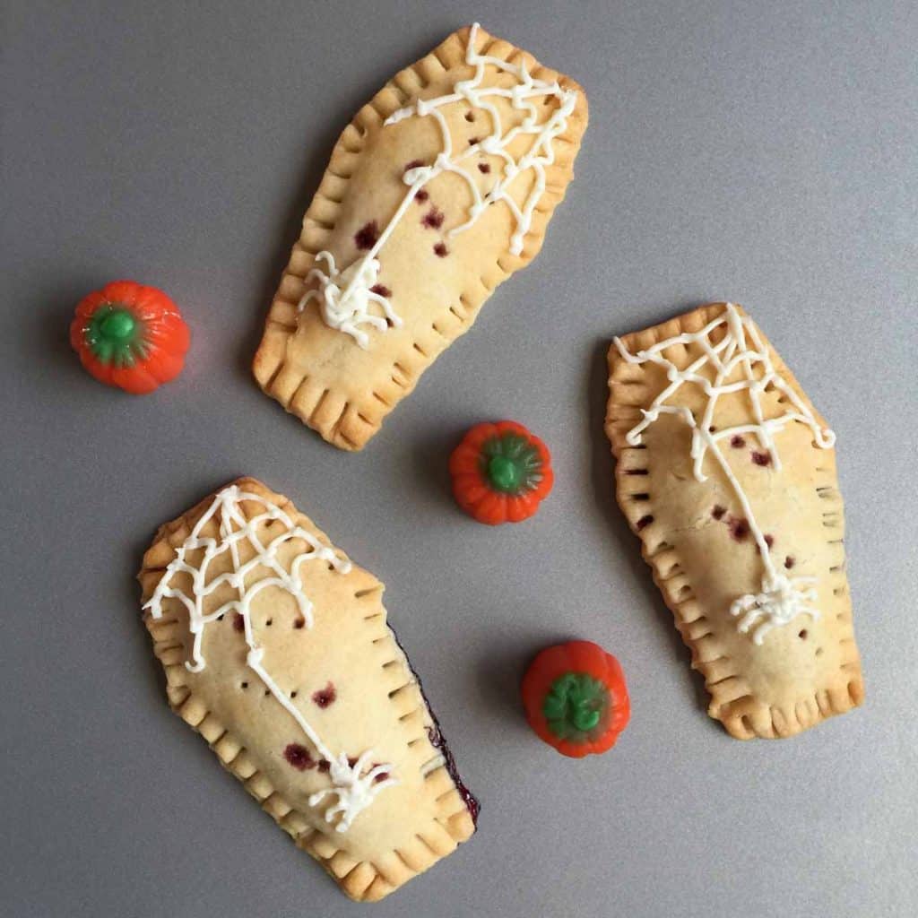 Homemade pop tarts that are shaped like coffins and filled with jelly.
