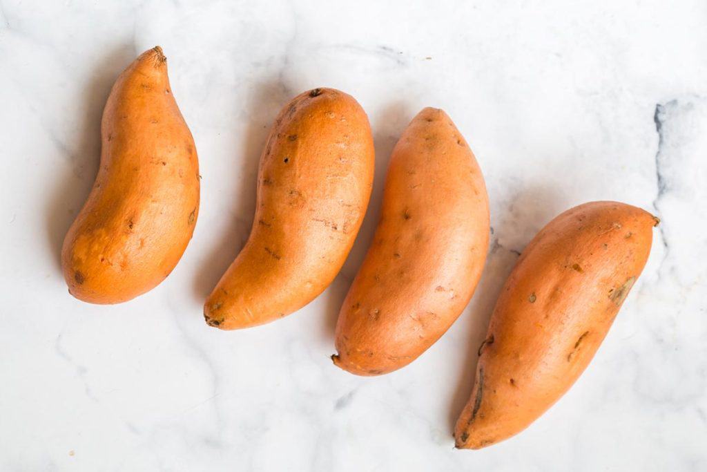 four whole sweet potatoes