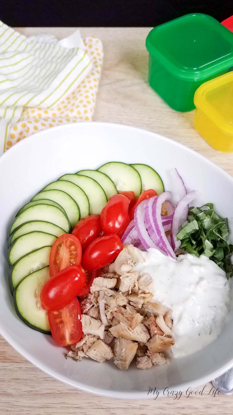 spaghetti squash chicken gyro bow with toppings in a white bowl